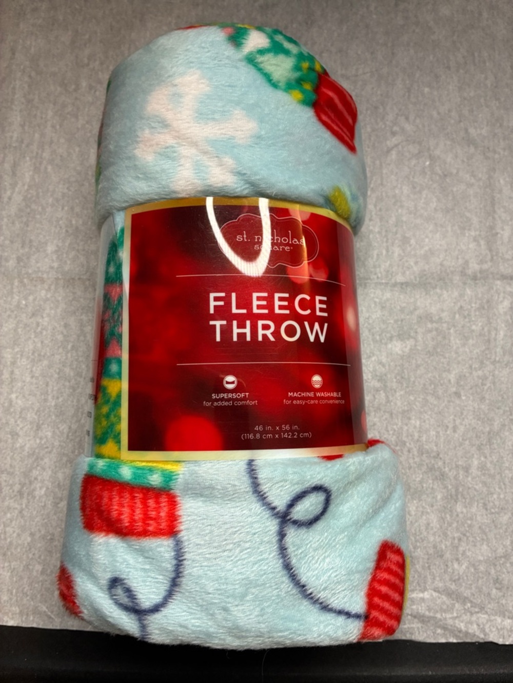St. Nicholas Square Light Blue Holiday Fleece Throw with Red and Green Motifs